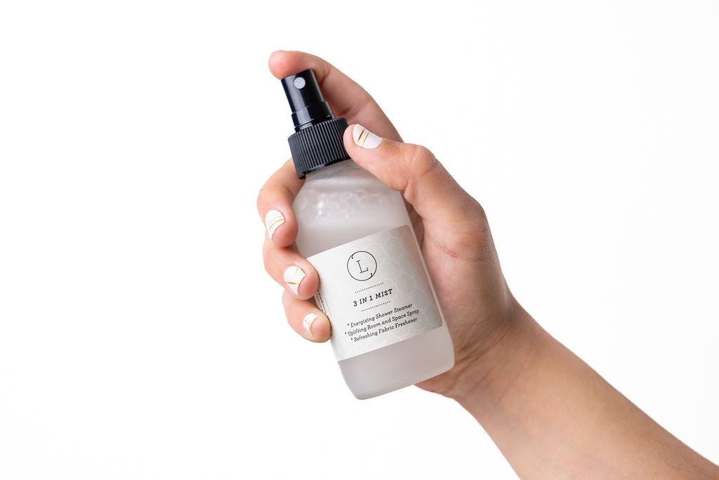 4oz frosted glass bottle of Shower Steamer Mist, infused with lavender for an aromatic shower experience.