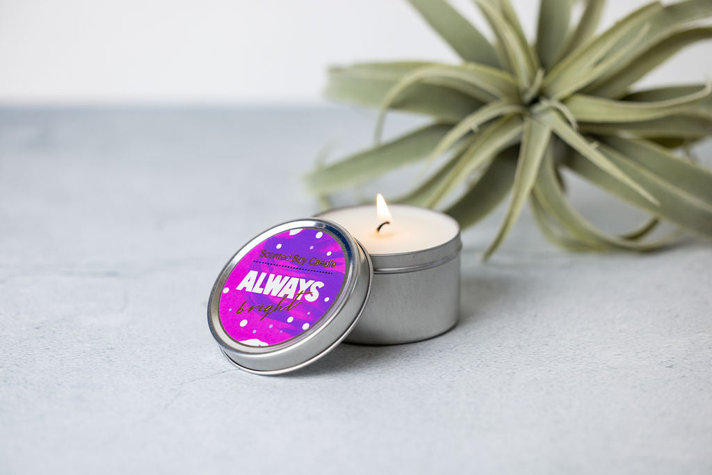 Scented soy candle in a tin, providing a calming lavender aroma for relaxation.