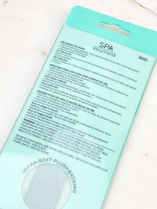 Back of package of gel bead eye mask in aqua with soft plush backing, designed to relieve puffy, strained, and tired eyes; can be used warm or cold for soothing relief and relaxation.