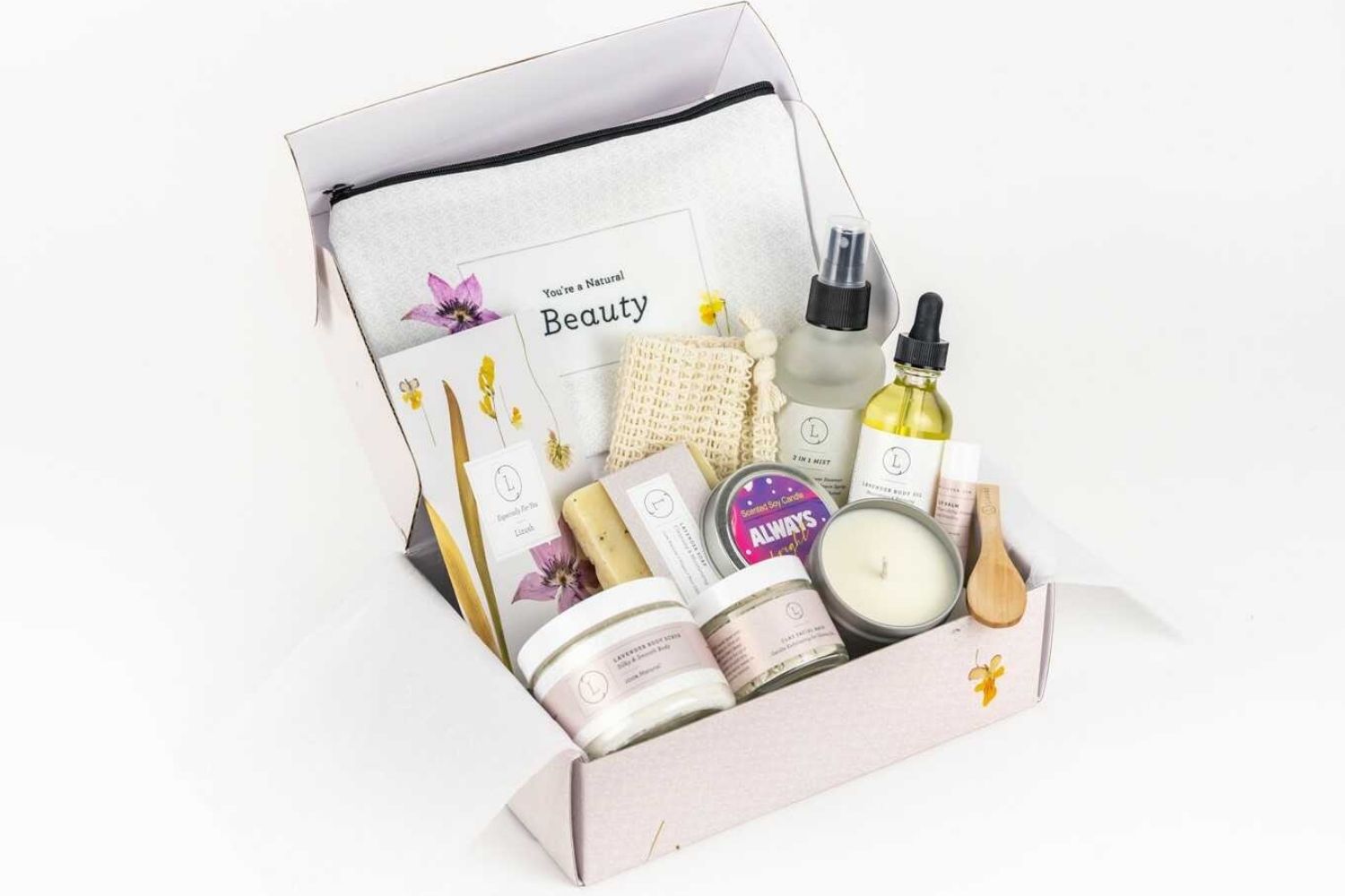 All-Natural Relaxation Spa Gift Box Set featuring Lavender Natural Soap Bar, Lavender Body Scrub, Lavender Body Oil, Shower Steamer Mist, Unscented Lip Balm, Facial Clay Mask, Cosmetic Bag, Scented Soy Candle in a Tin, Exfoliating Soap Saver, and a customizable box with a personal note.