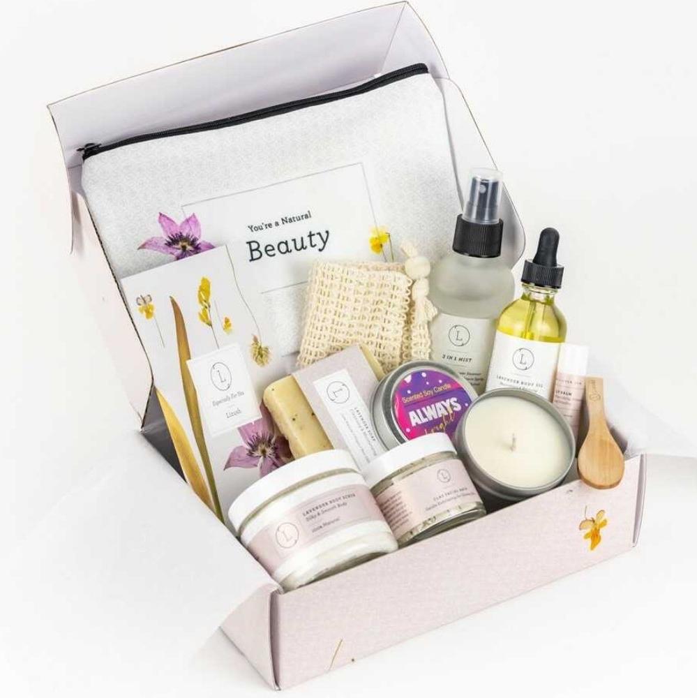 All-Natural Relaxation Spa Gift Box Set featuring Lavender Natural Soap Bar, Lavender Body Scrub, Lavender Body Oil, Shower Steamer Mist, Unscented Lip Balm, Facial Clay Mask, Cosmetic Bag, Scented Soy Candle in a Tin, Exfoliating Soap Saver, and a customizable box with a personal note.